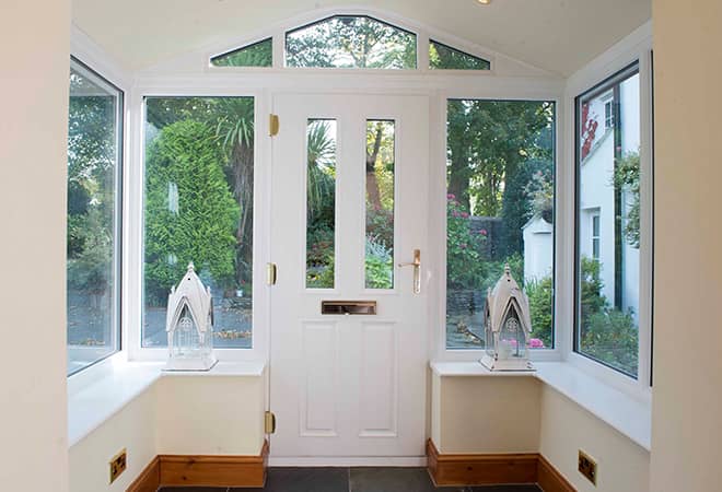 White Everest conservatory entrance with windows and door