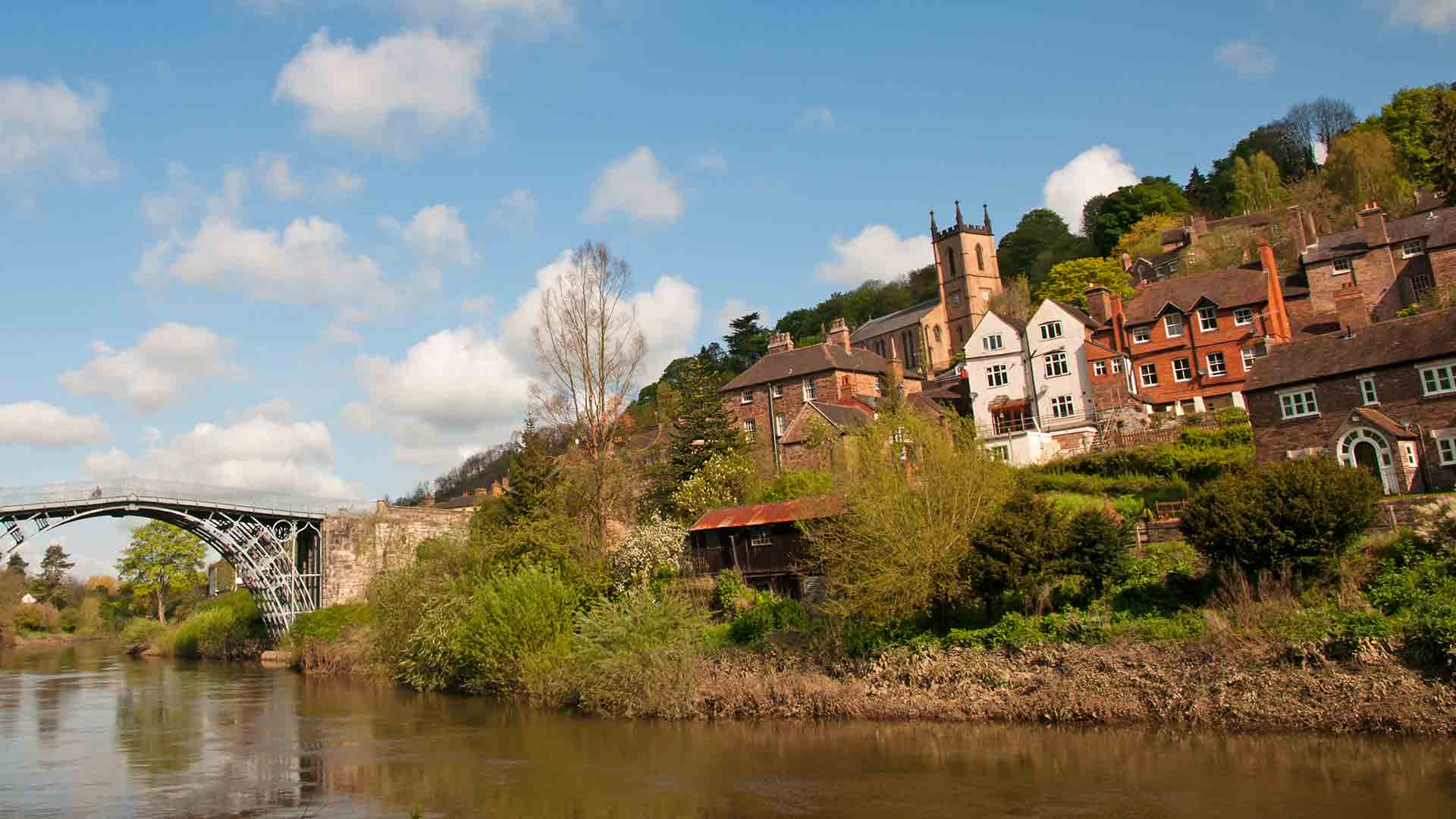 River scene with historic buildings and bridge