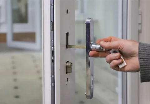 Person unlocking Everest conservatory door with chrome handle