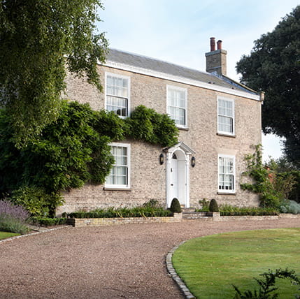 Stone house with white door and windows