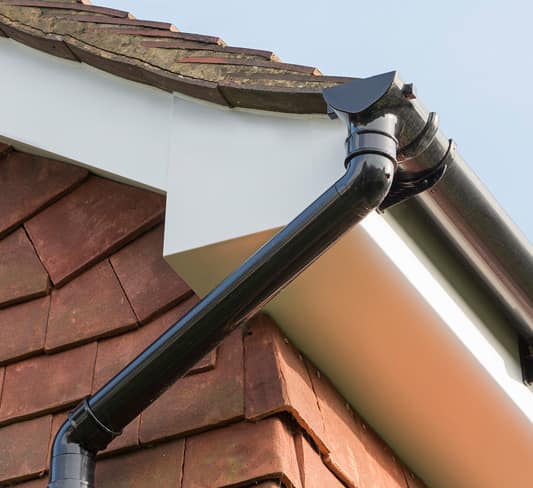 Black gutter on Everest conservatory with red brick wall