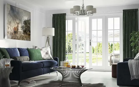 Everest conservatory with dark green velvet curtains and white French doors