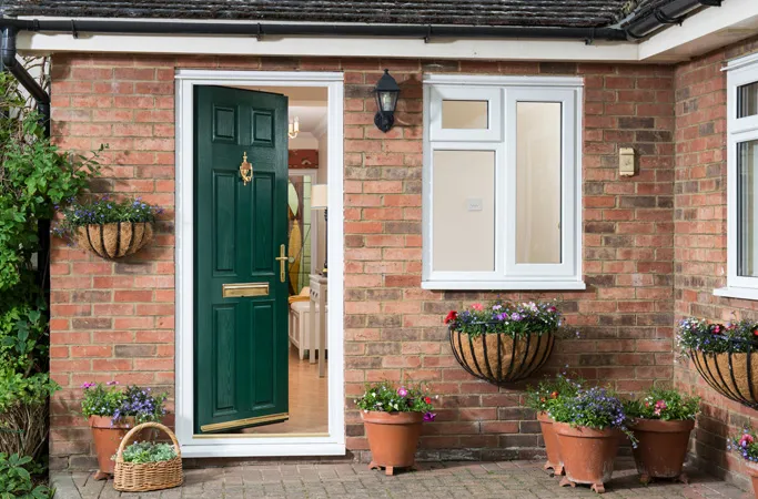 Everest conservatory green door with flowers