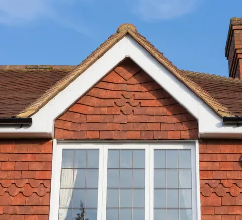 Red tiled roof and white window