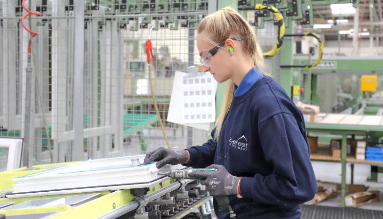 Woman assembling Everest conservatory window