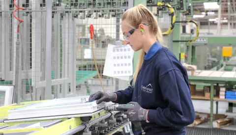 Woman assembling Everest conservatory window