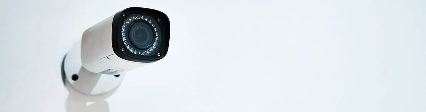 White security camera mounted on wall
