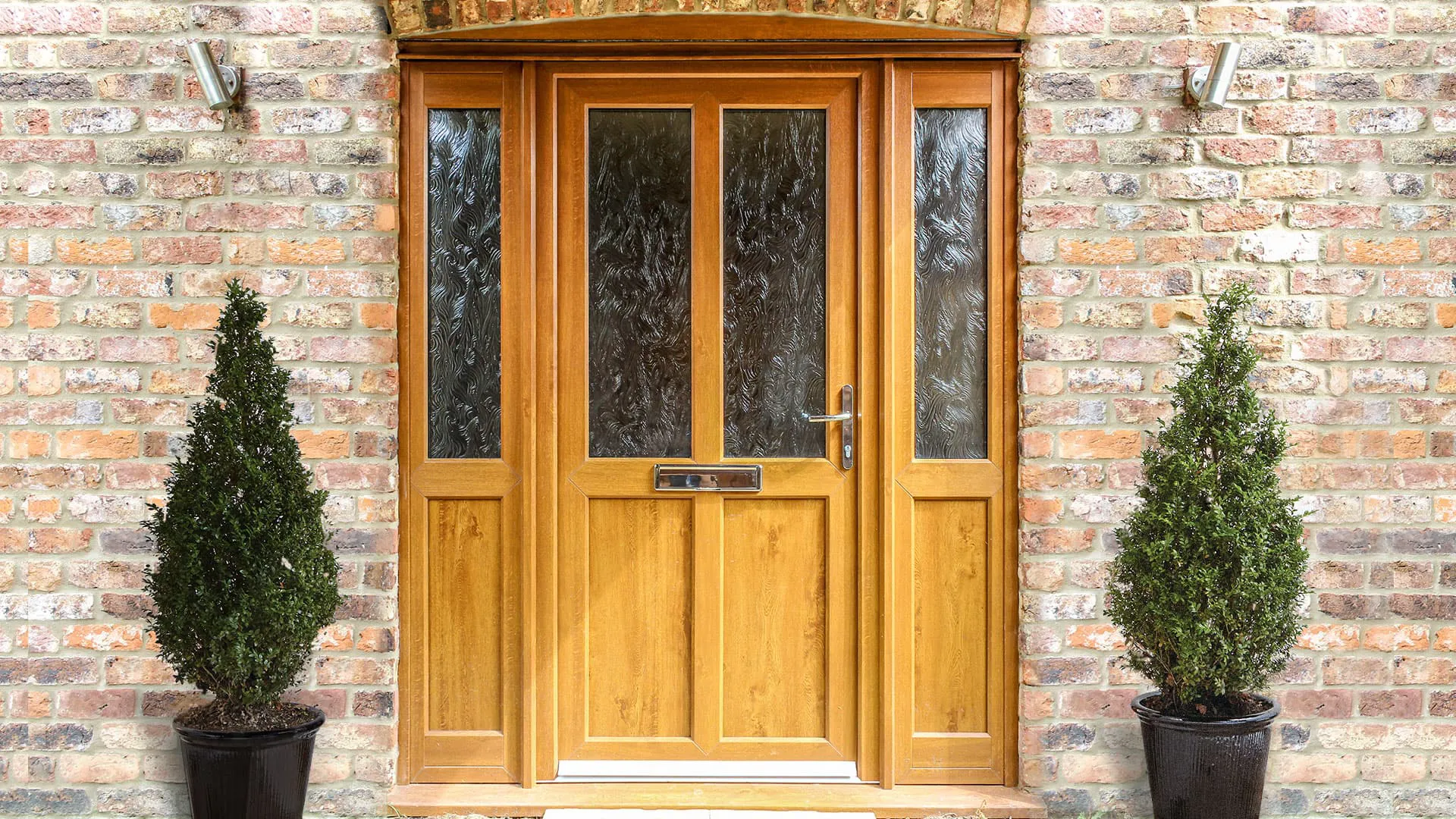 Wooden front door with leaded glass panels and brick wall