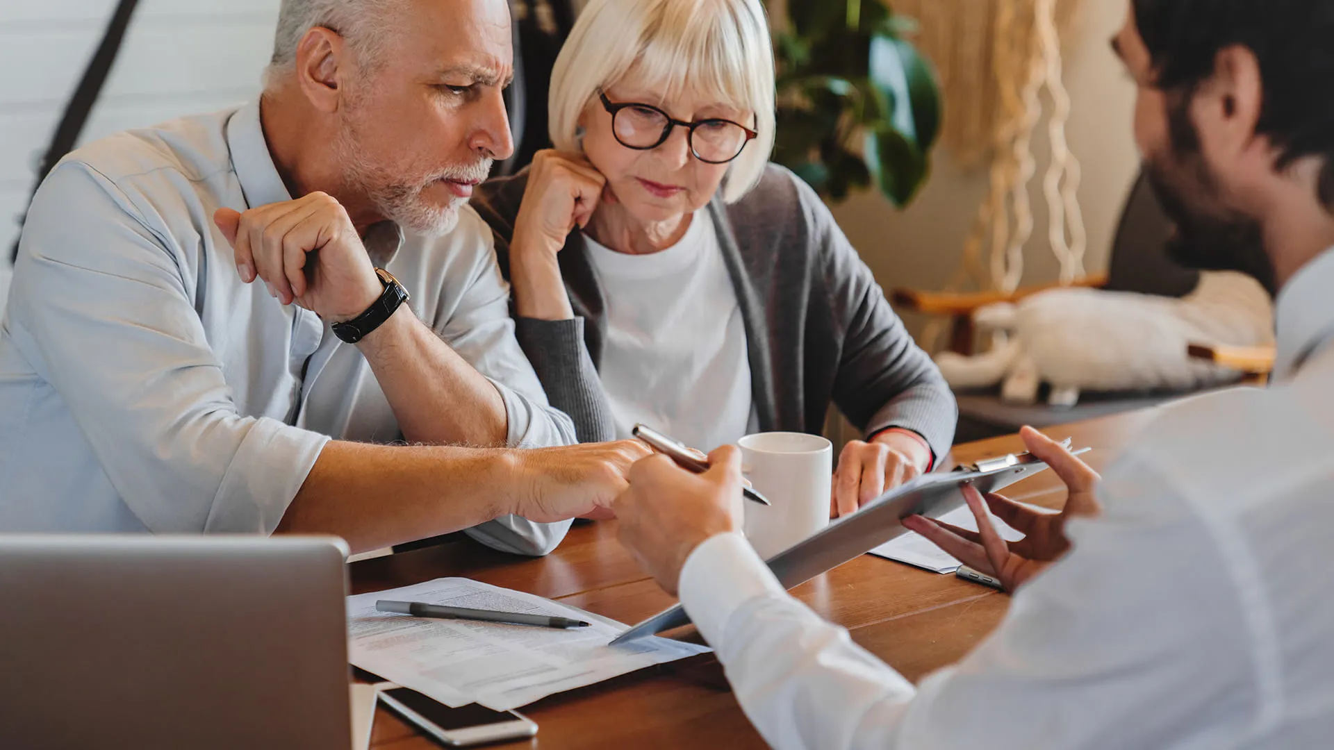 Couple reviewing documents with agent