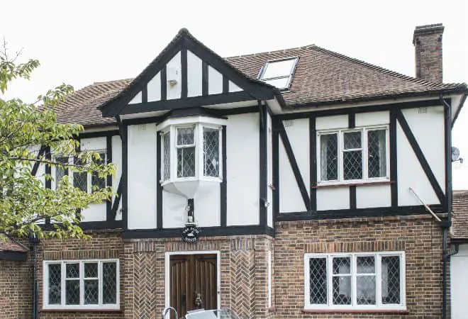 White and black timber framed house exterior