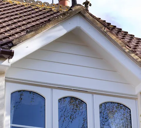 White siding and gables on a house