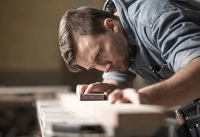 Man working on a Everest amdega door
