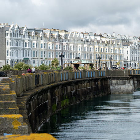 Coastal wall with buildings and water