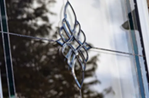 Detailed decorative glass design on Everest conservatory window