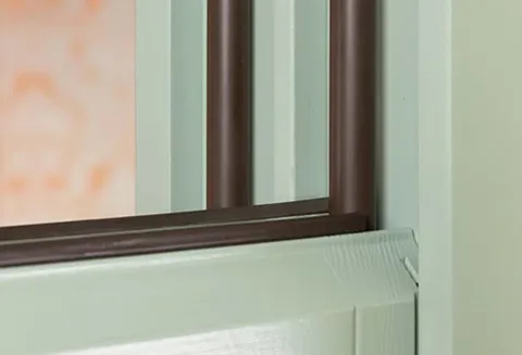 Everest conservatory window frame detail with dark brown seals