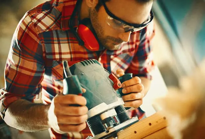 Man sanding down an Everest amdega door