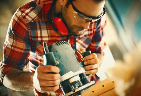 Man sanding down an Everest amdega door