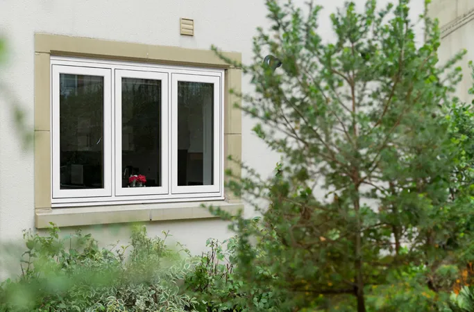 White Everest conservatory window with light beige stone surround
