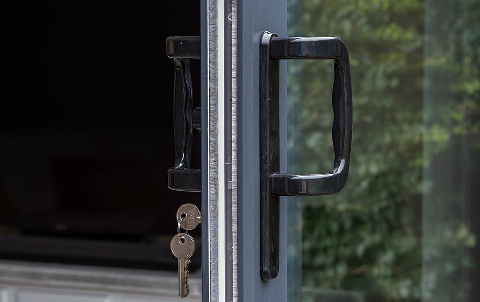 Black handle on grey Everest conservatory door with keys