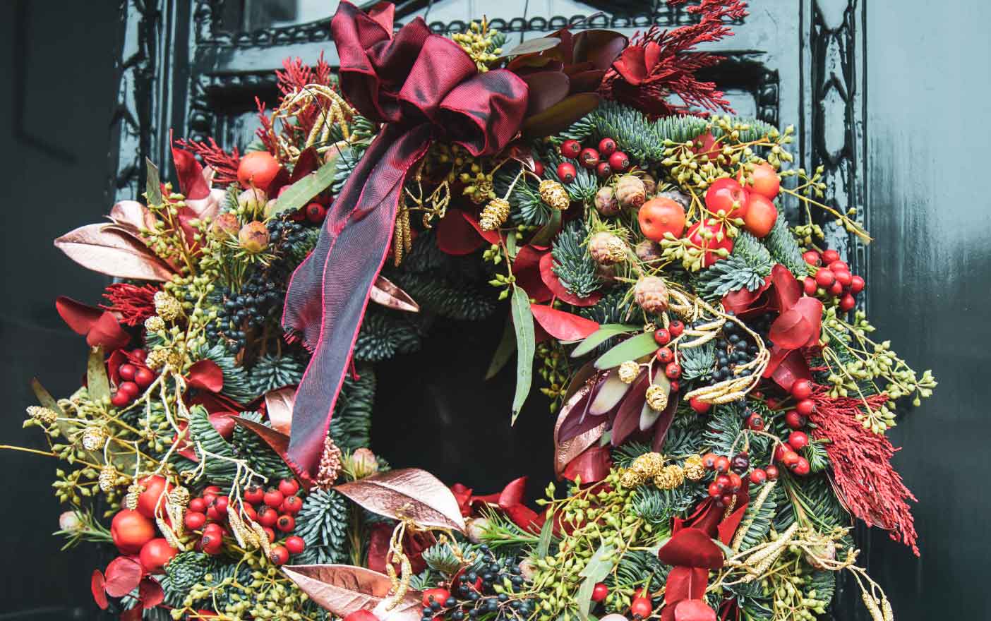 Christmas wreath with red, gold, and green accents