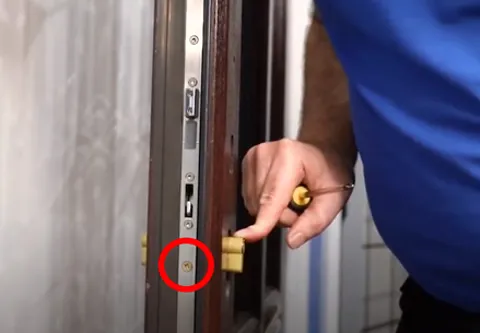Screw being inserted in door frame