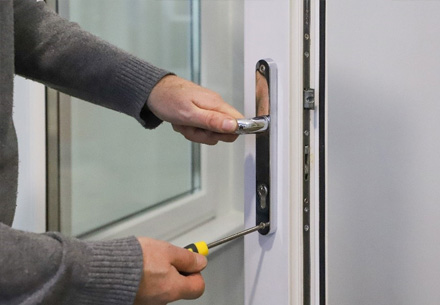 Installing door handle with screwdriver