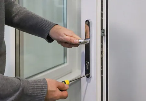 Installing door handle with screwdriver