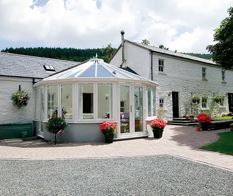 White Everest conservatory with windows and plants