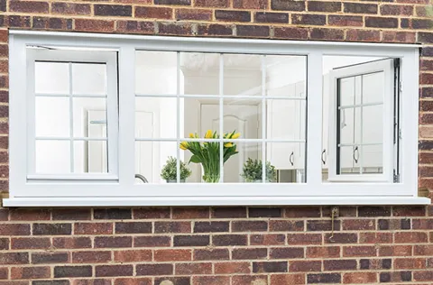 White Everest window on brick wall