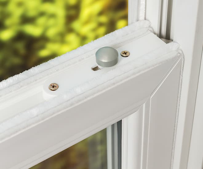 Everest conservatory white window detail with white wiper and grey button