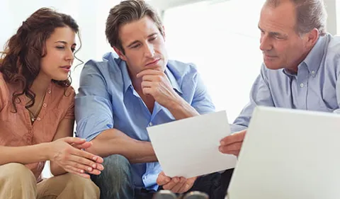 People reviewing documents