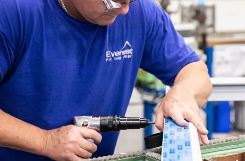 Person using power tool on Everest conservatory component