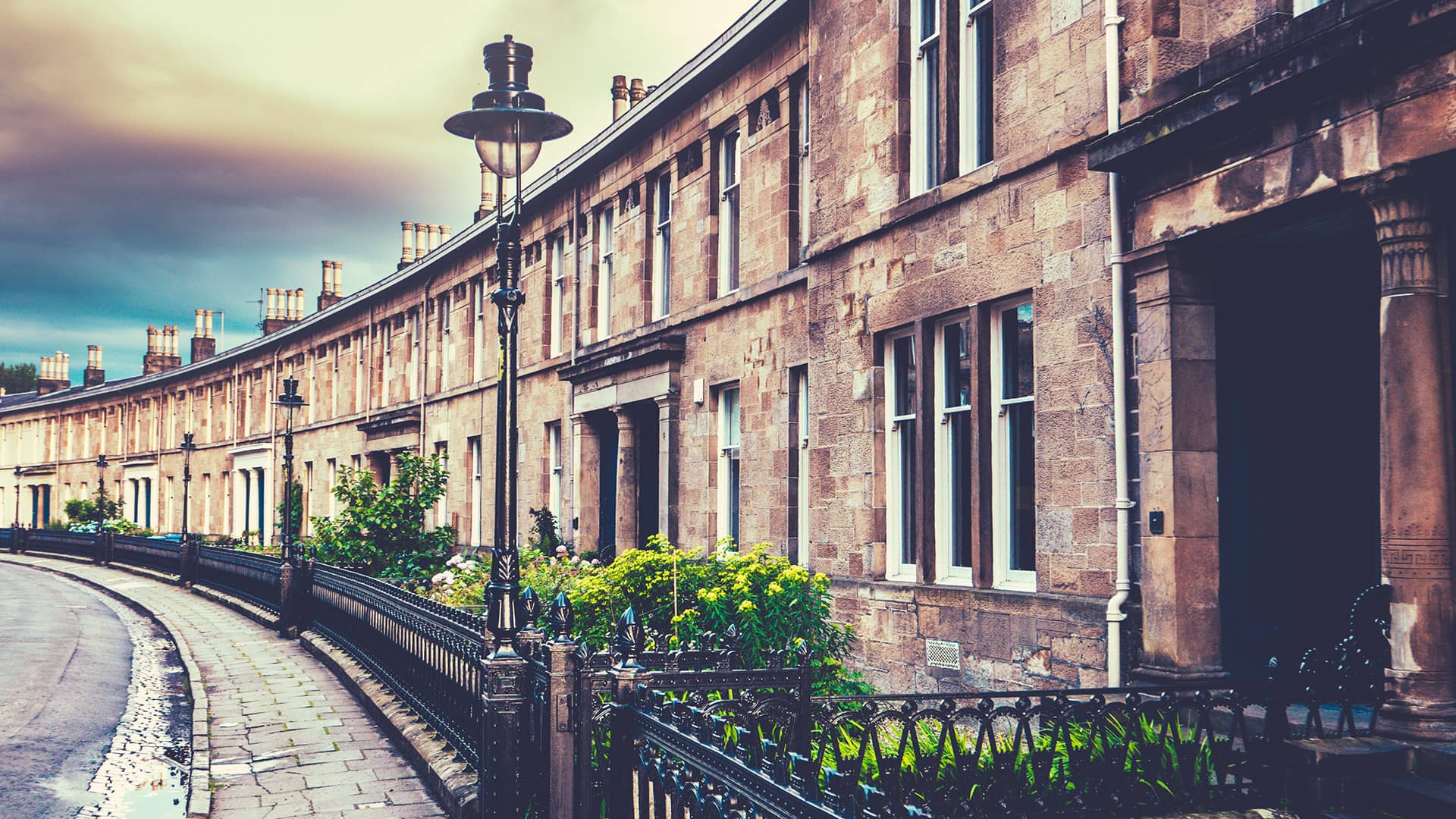 Stone row houses with black wrought iron fencing