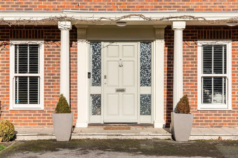 Cream coloured door with ornate glass on Everest conservatory
