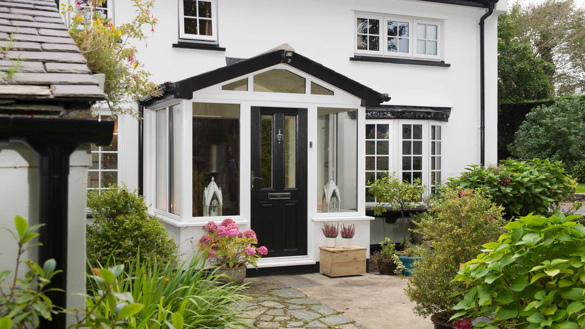 White house with black Everest conservatory door