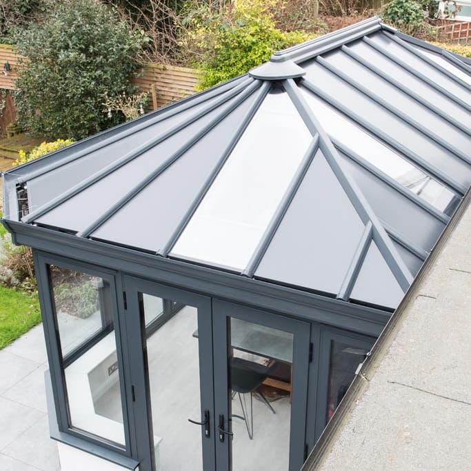 Grey Everest conservatory roof with glass panels