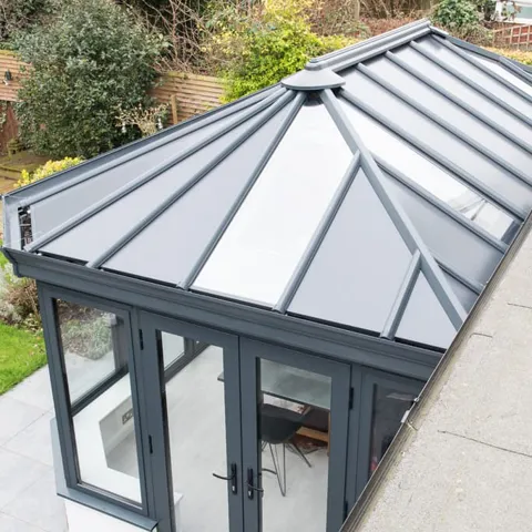 Grey Everest conservatory roof with glass panels