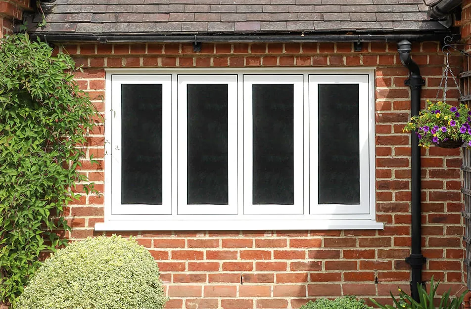 White Everest conservatory window with dark glass