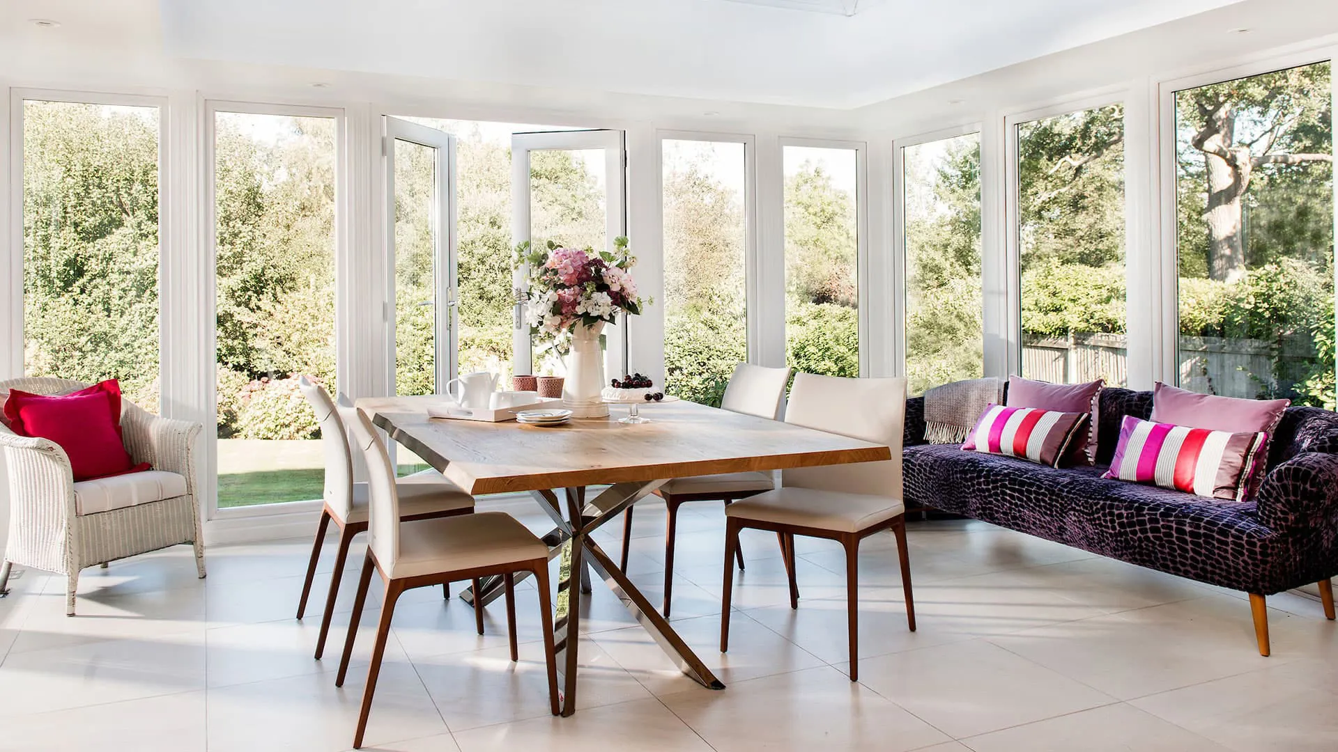 Everest conservatory dining area with garden view