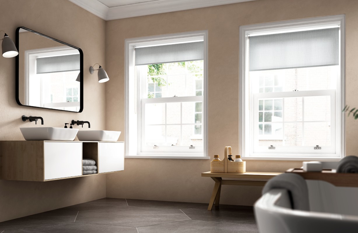 Beige bathroom with white double sink vanity and windows