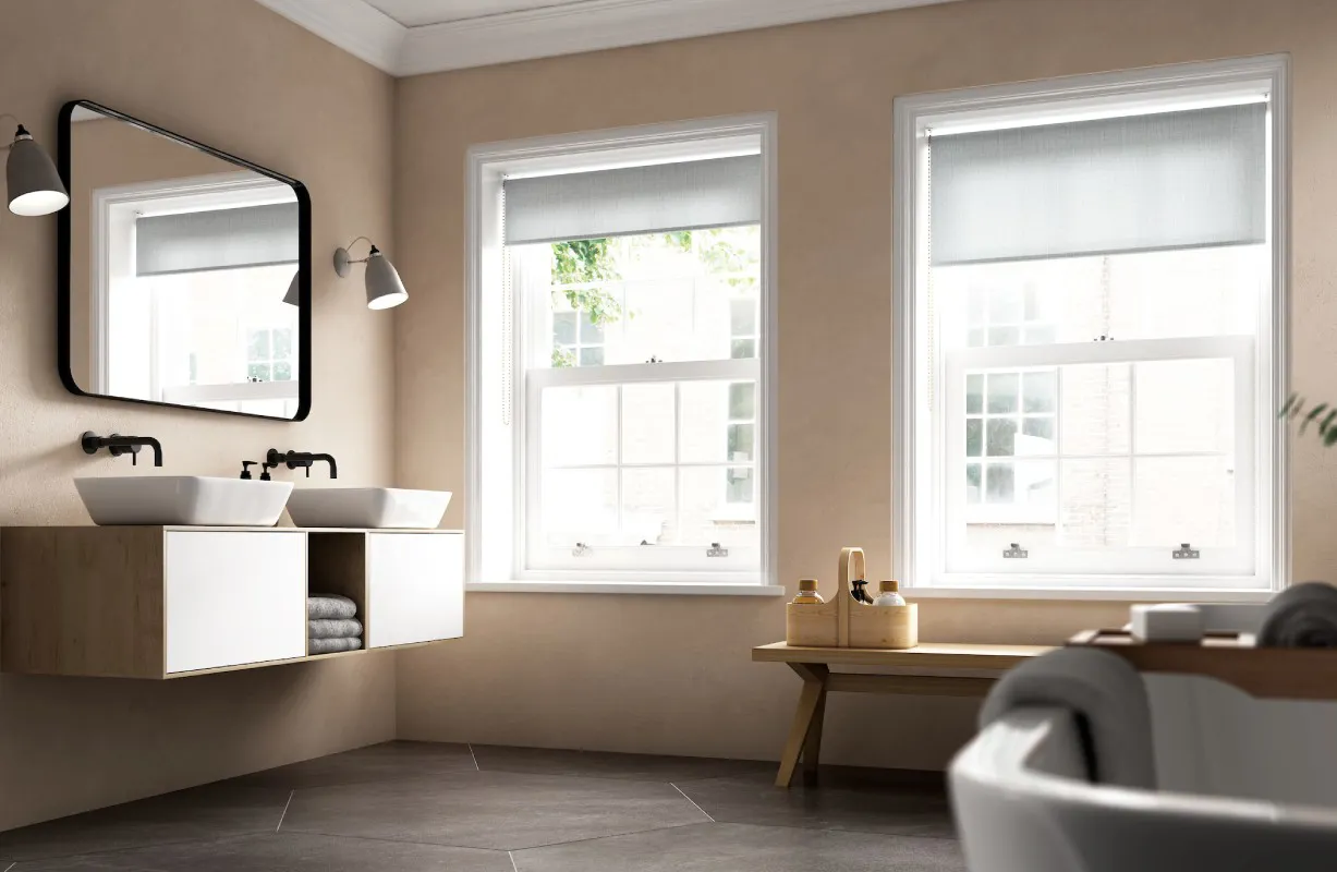 Beige bathroom with white double sink vanity and windows