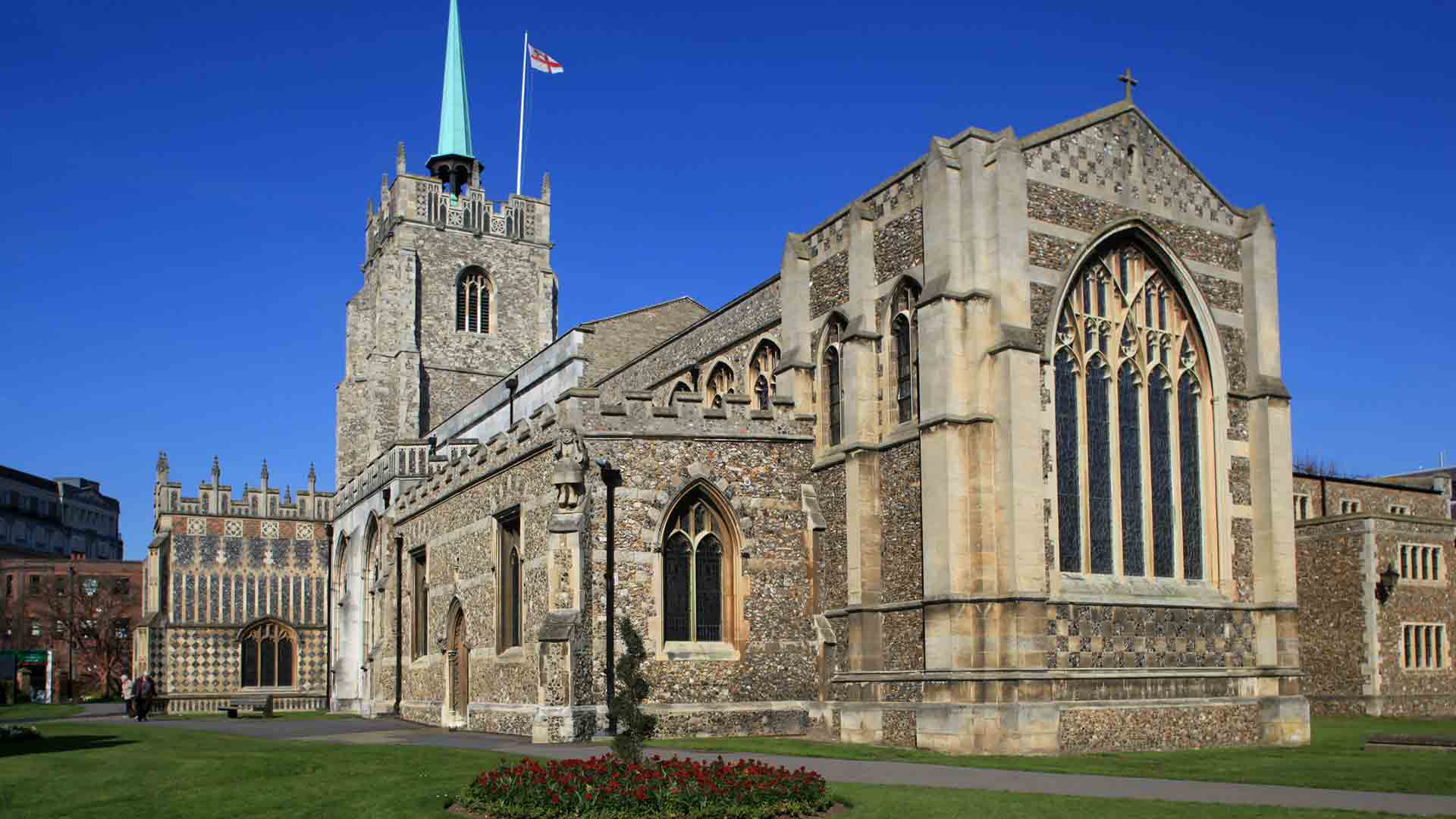 Stone church facade with arched windows
