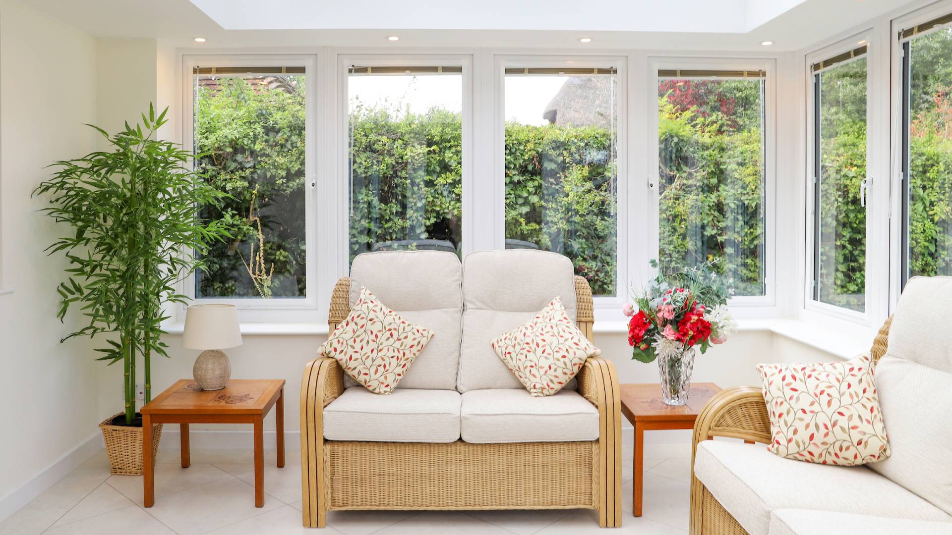 Everest conservatory with cream sofa and wicker armchairs