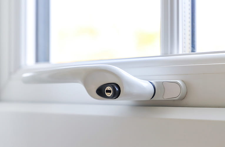 White window handle with lock and security features