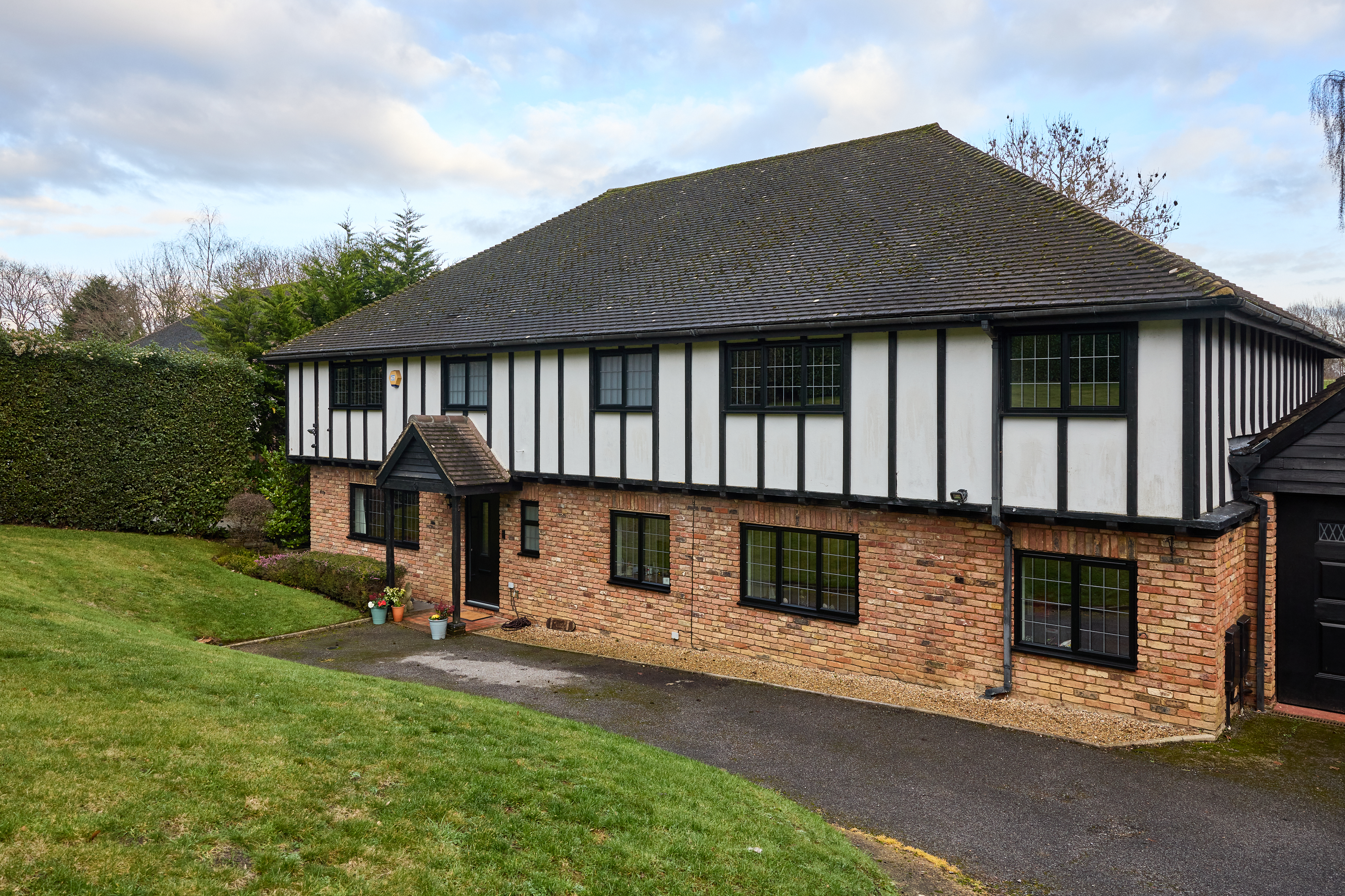 Black aluminium windows and a black composite door