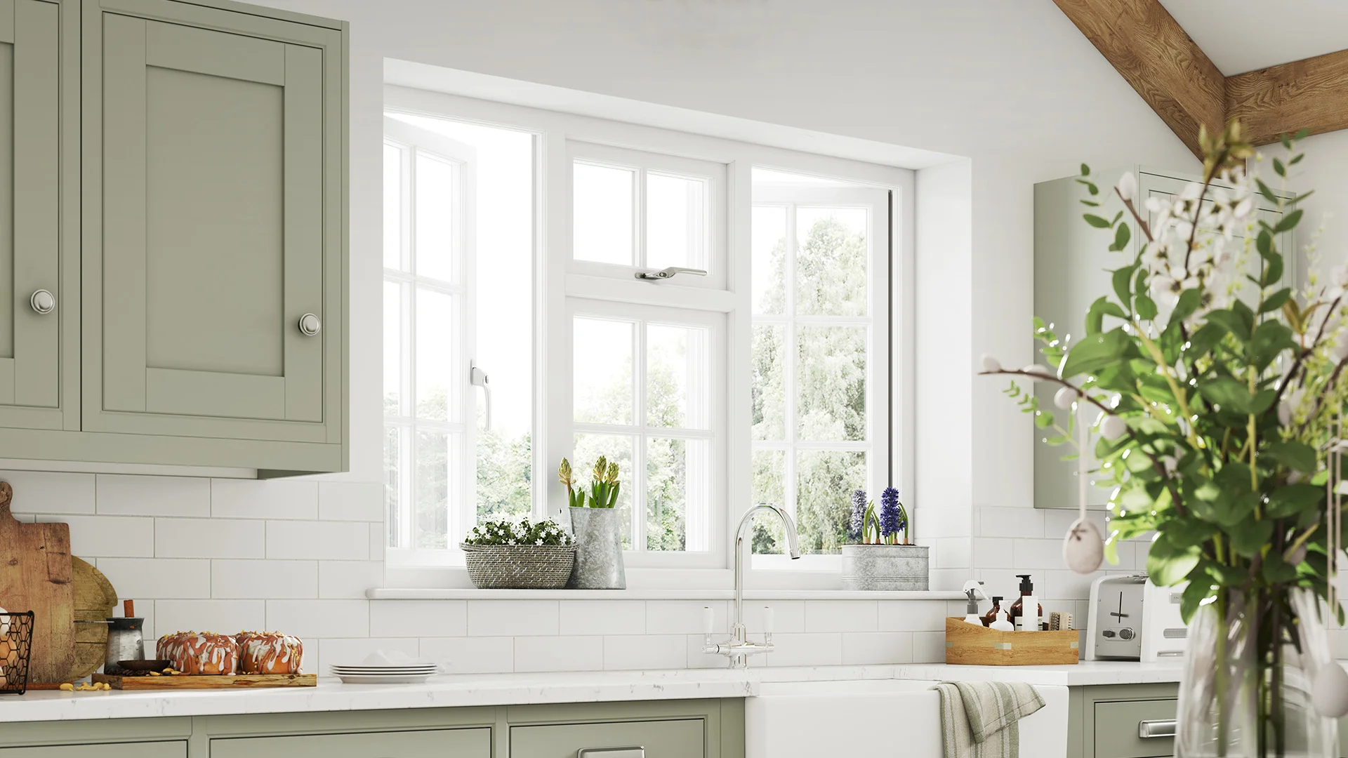 Sage green kitchen cabinets with white window and flowers