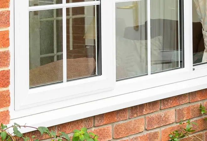 White Everest conservatory window against brick wall
