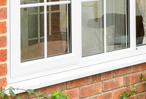 White Everest conservatory window against brick wall