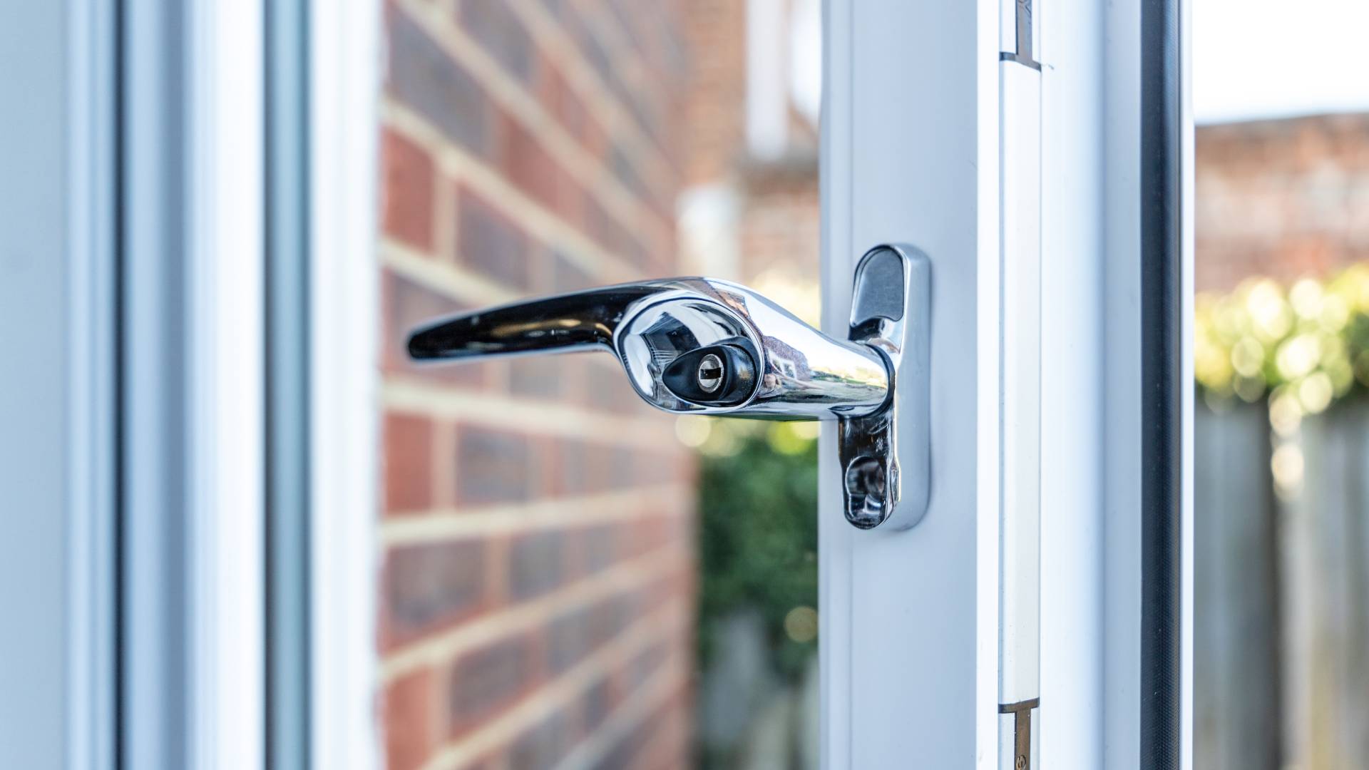 Chrome handle on white Everest conservatory window