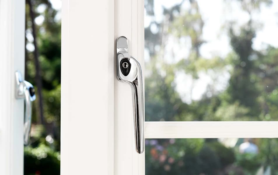 Chrome window handle on white Everest conservatory window